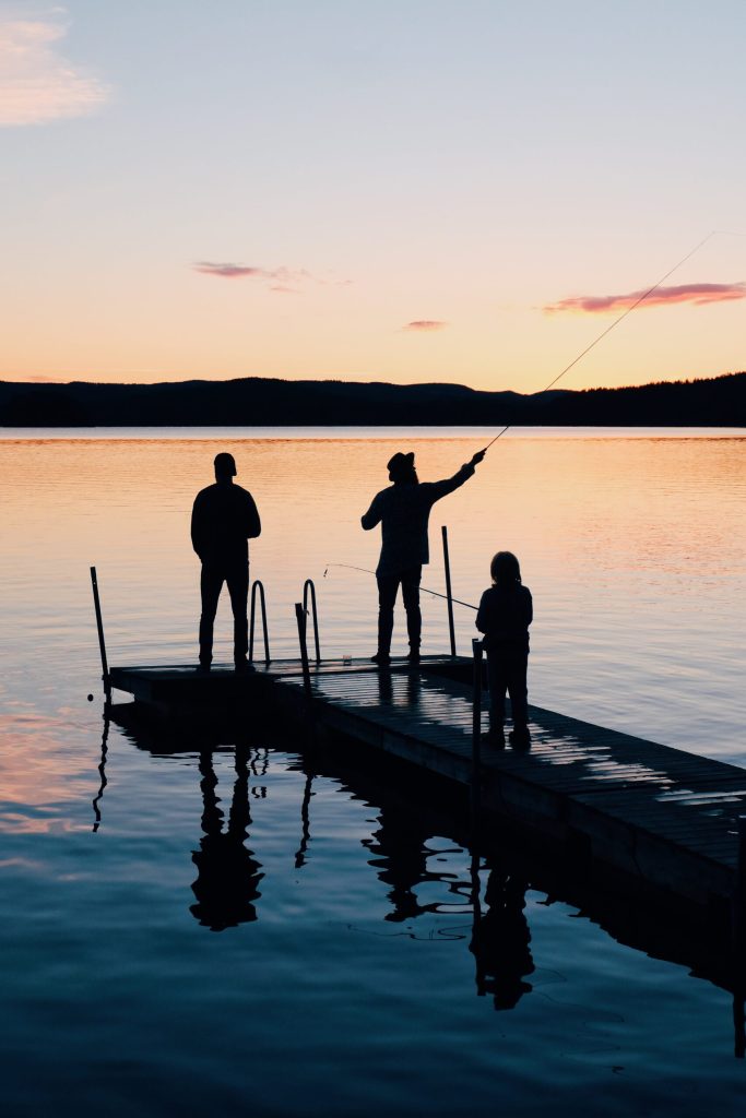Three People on a Wooden Fishing Docks